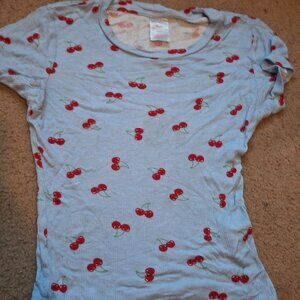 Blue shirt with red cherries